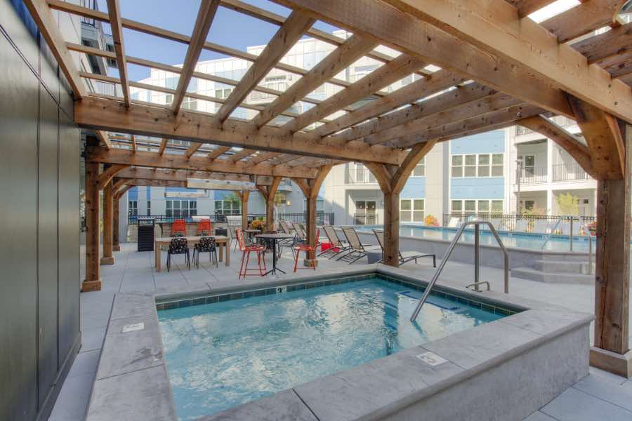 Hot tub and wood pergola at apartment building